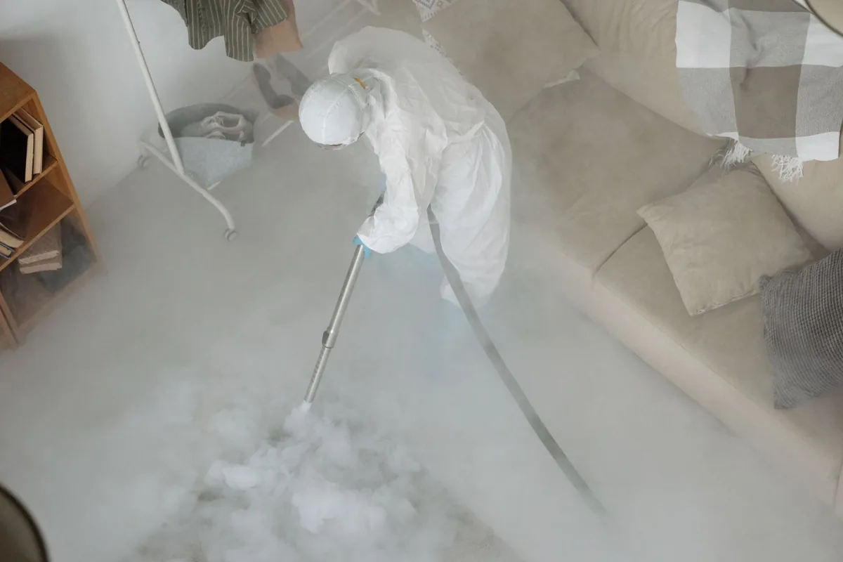 Biohazard cleanup technician in protective equipment, Lyons, NJ